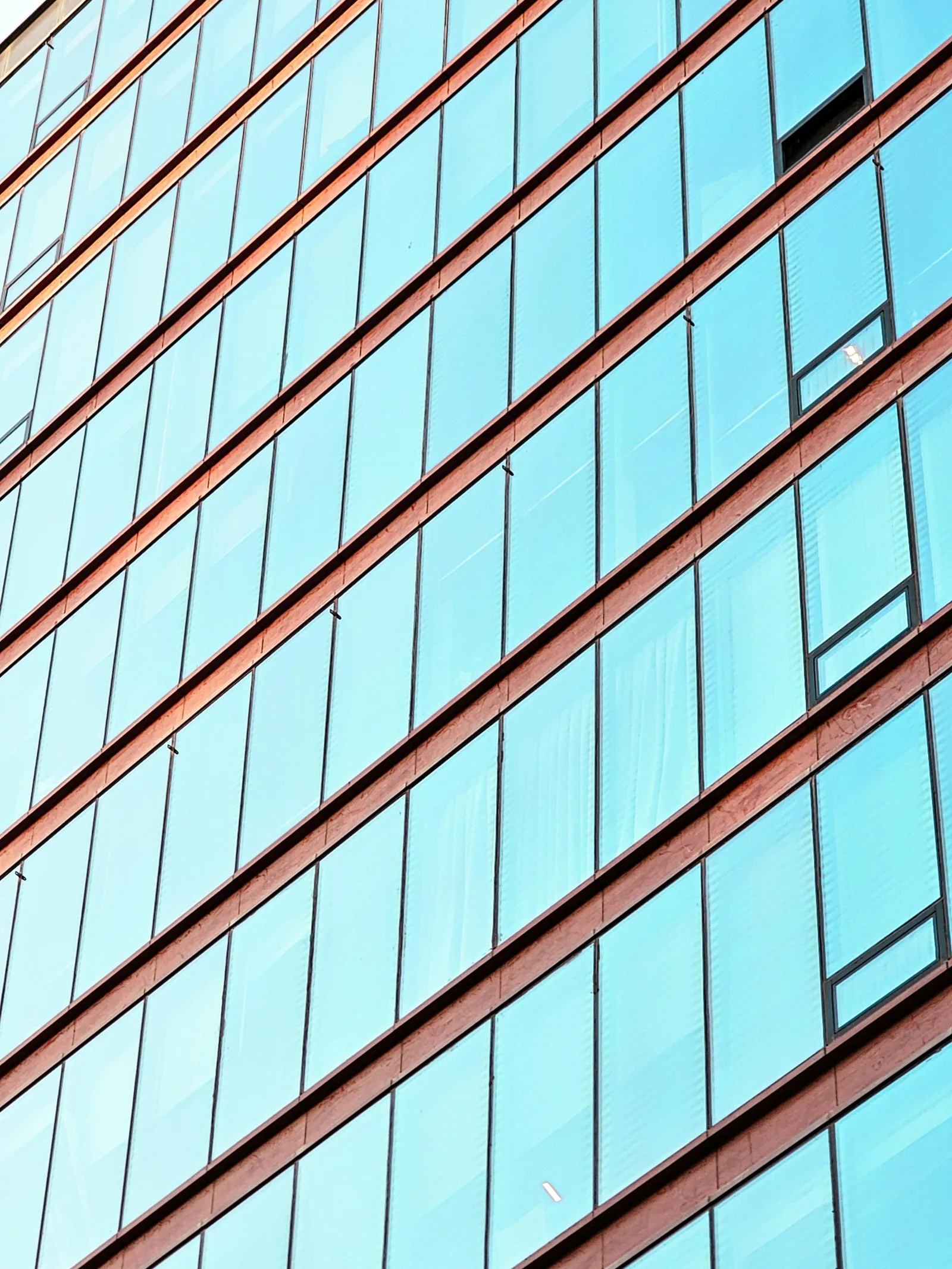 Clean glass commercial building facade with no people